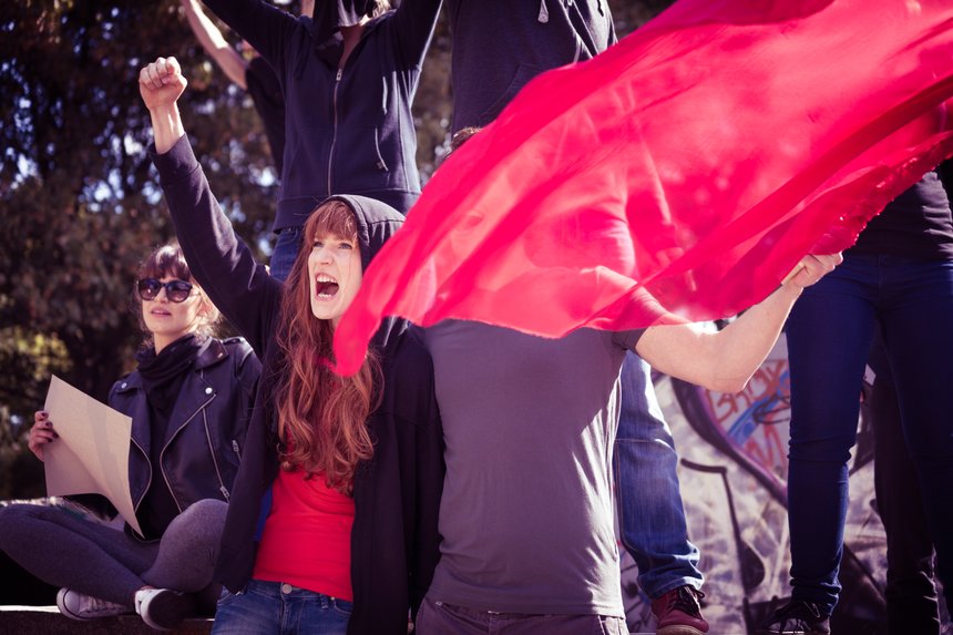 Demonstrators with red flag