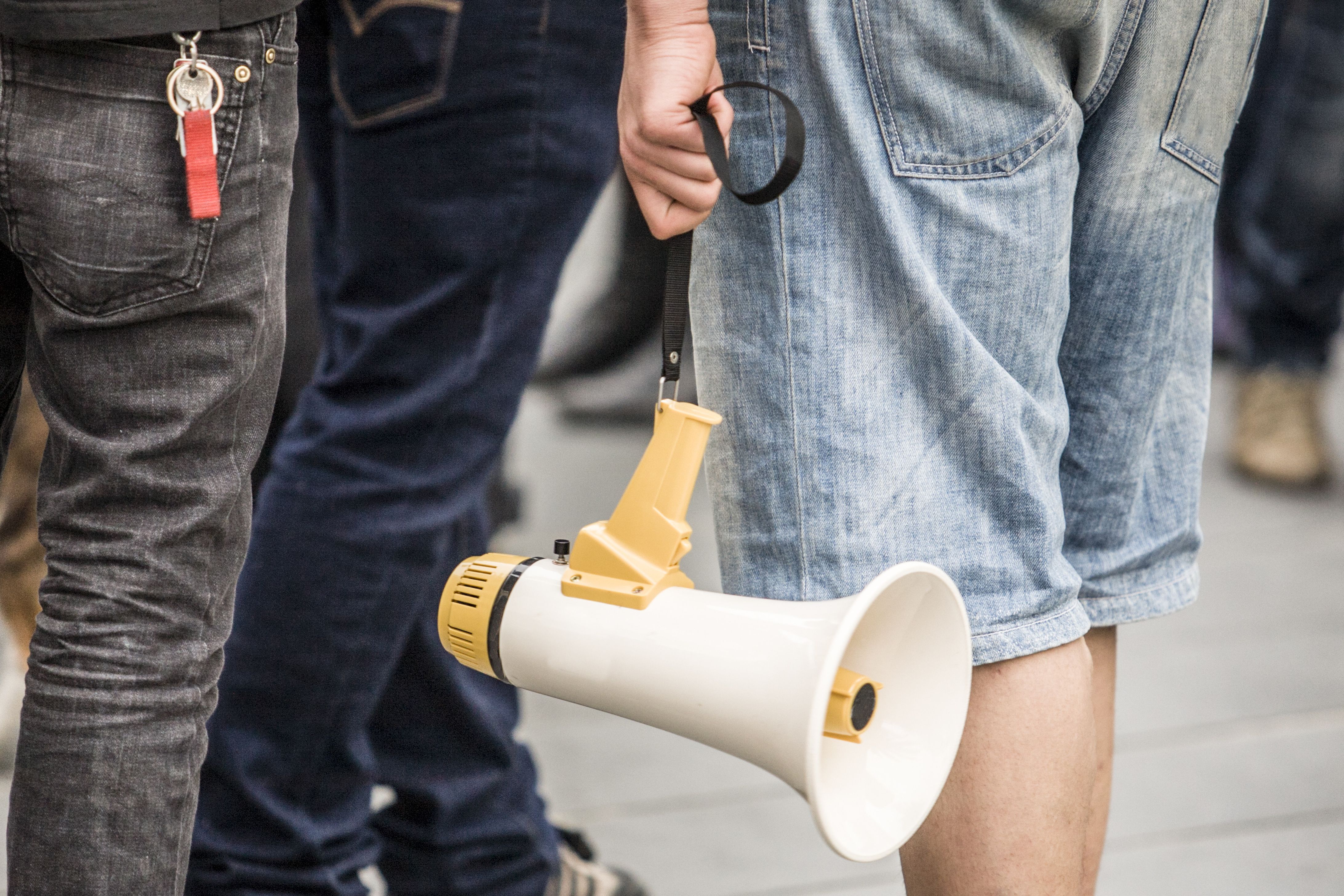 young demostrator with megaphone