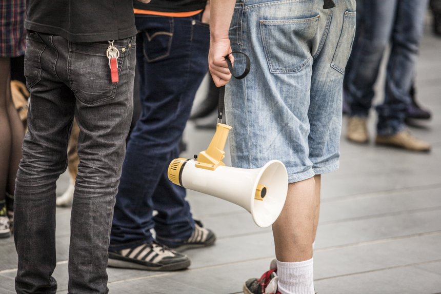 young demostrator with megaphone