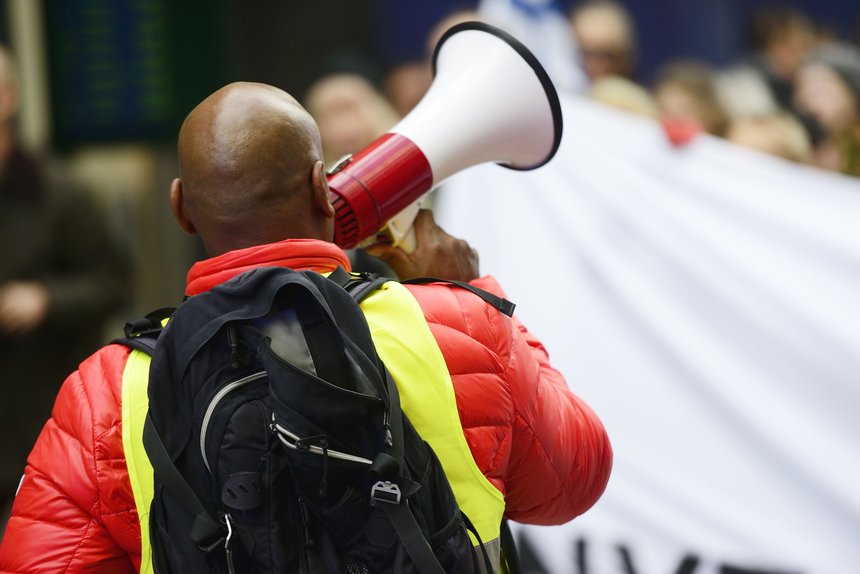 an activist with megaphone on the protest action