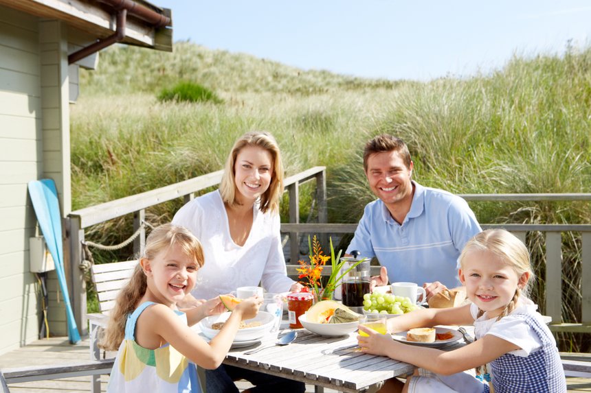 Family on vacation eating outdoors