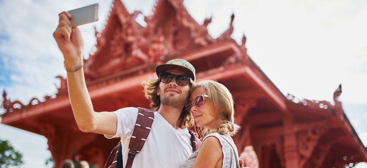 tourists taking photos at temple on koh samui thailand