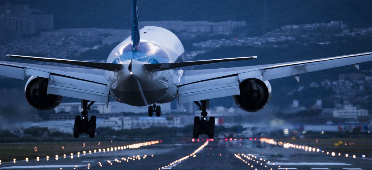 In the evening, the plane is about to land on the runway