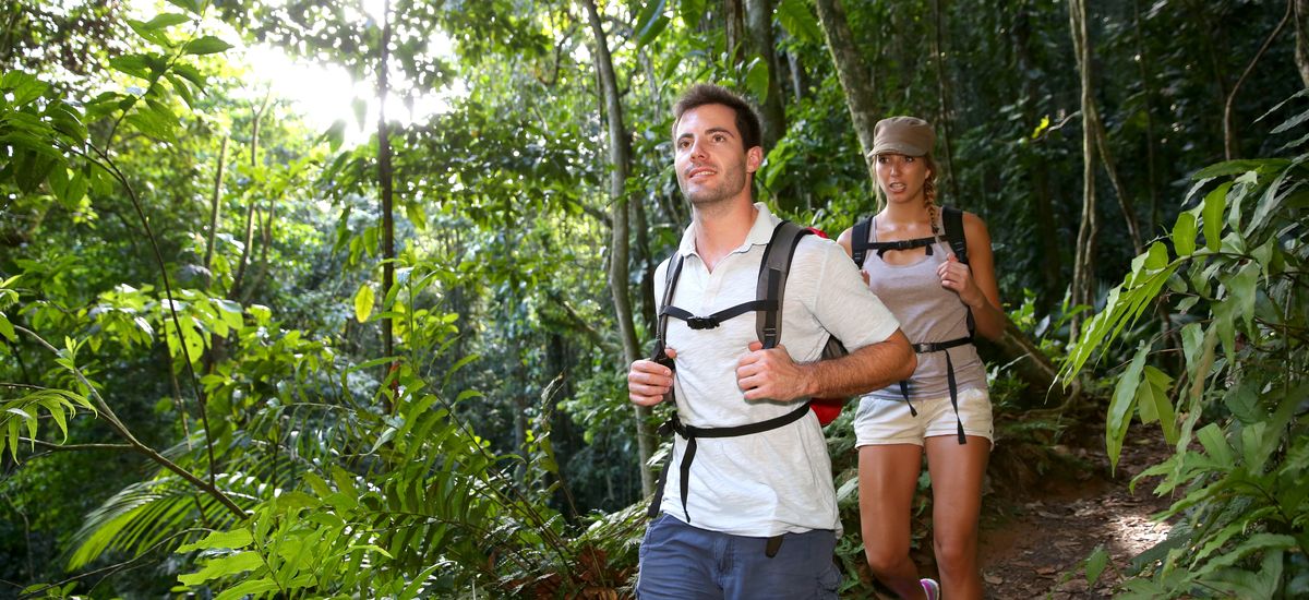 Couple on a trekking day in tropical forest