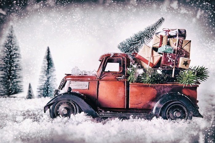 Winter greeting card with red vintage truck