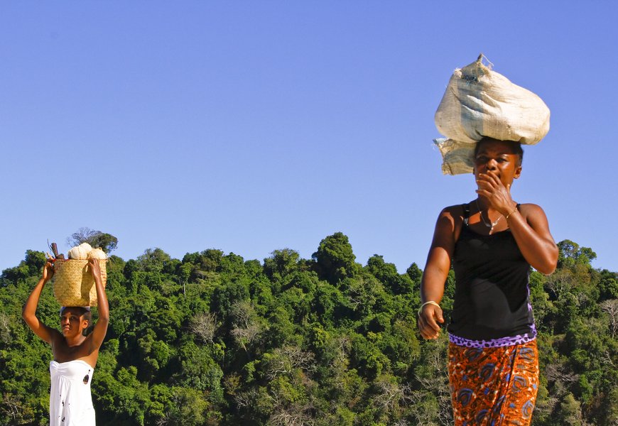 Malagasy woman carrying cargo on head