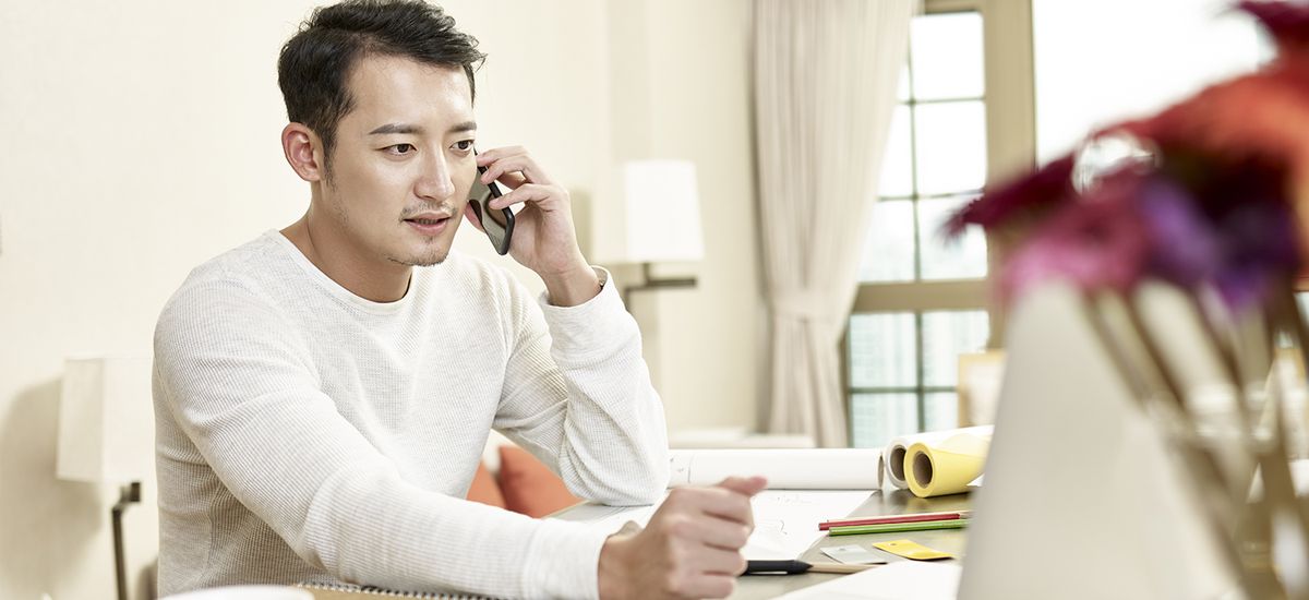 young asian businessman working from home