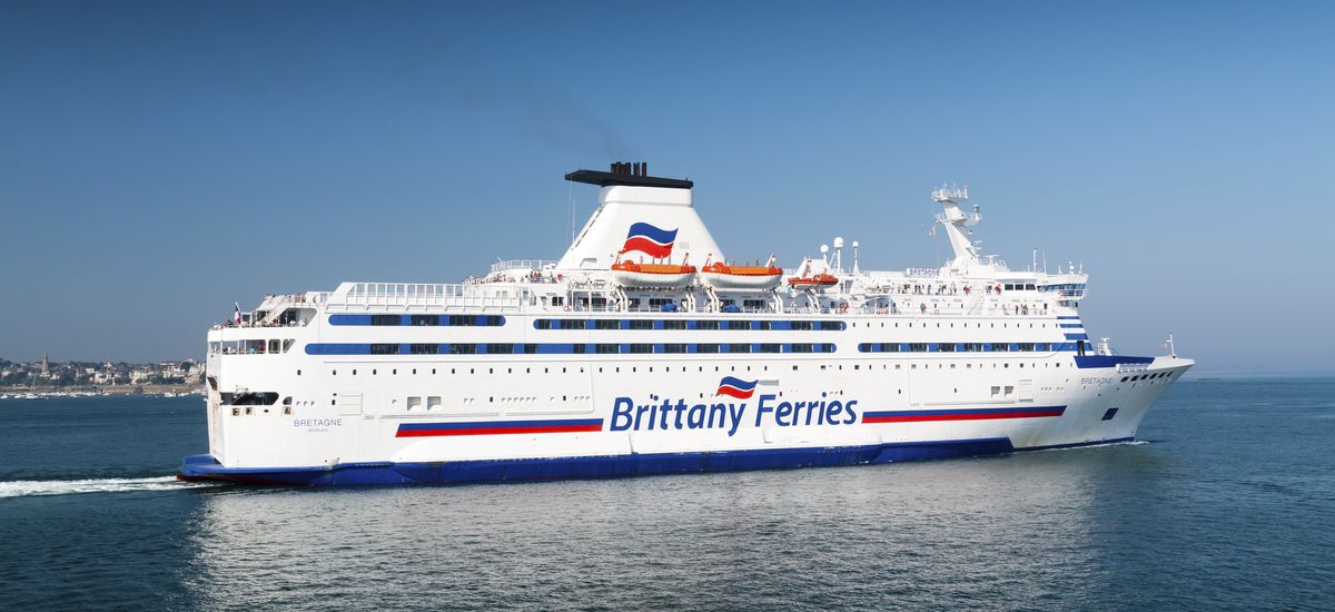 Saint Malo, Brittany, France - July 8, 2018: Brittany Ferries cross channel ferry Bretagne sailing from the port of Saint Malo on a hot summer day with a clear blue sky