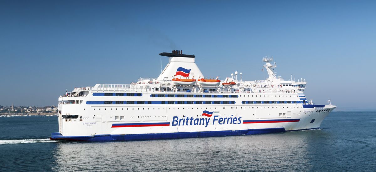 Saint Malo, Brittany, France - July 8, 2018: Brittany Ferries cross channel ferry Bretagne sailing from the port of Saint Malo on a hot summer day with a clear blue sky