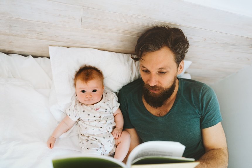 Father and baby daughter reading book fairytale at home lifestyle dad teaching child infant parent childhood education concept Fathers day holiday