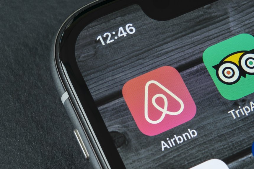 Sankt-Petersburg, Russia, April 10, 2018: Airbnb application icon on Apple iPhone X screen close-up. Airbnb app icon. Airbnb.com is online website for booking rooms. social media network.