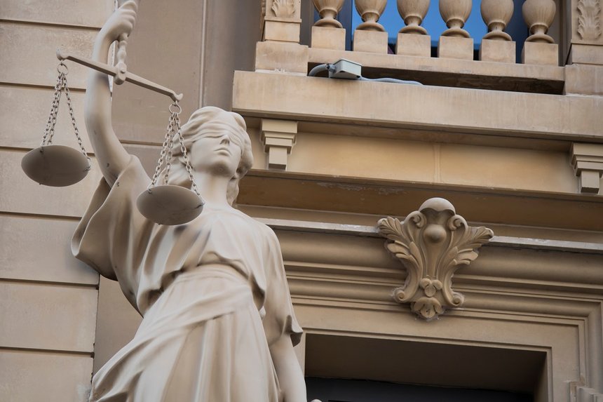 The statue of justice with a scales and a sword in his hand was 