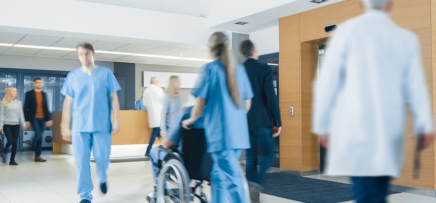 Hospital Lobby. Doctors, Nurses, Assistant Personnel and Patient