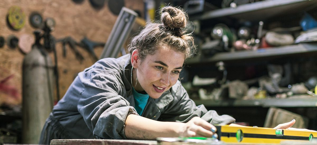 young woman working in workshop