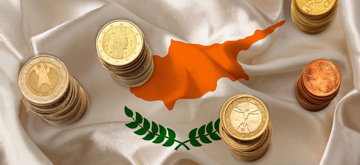 metal currency coins on the background of the national flag of t