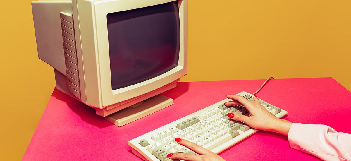 Colorful image of vintage computer monitor and keyboard on brigh