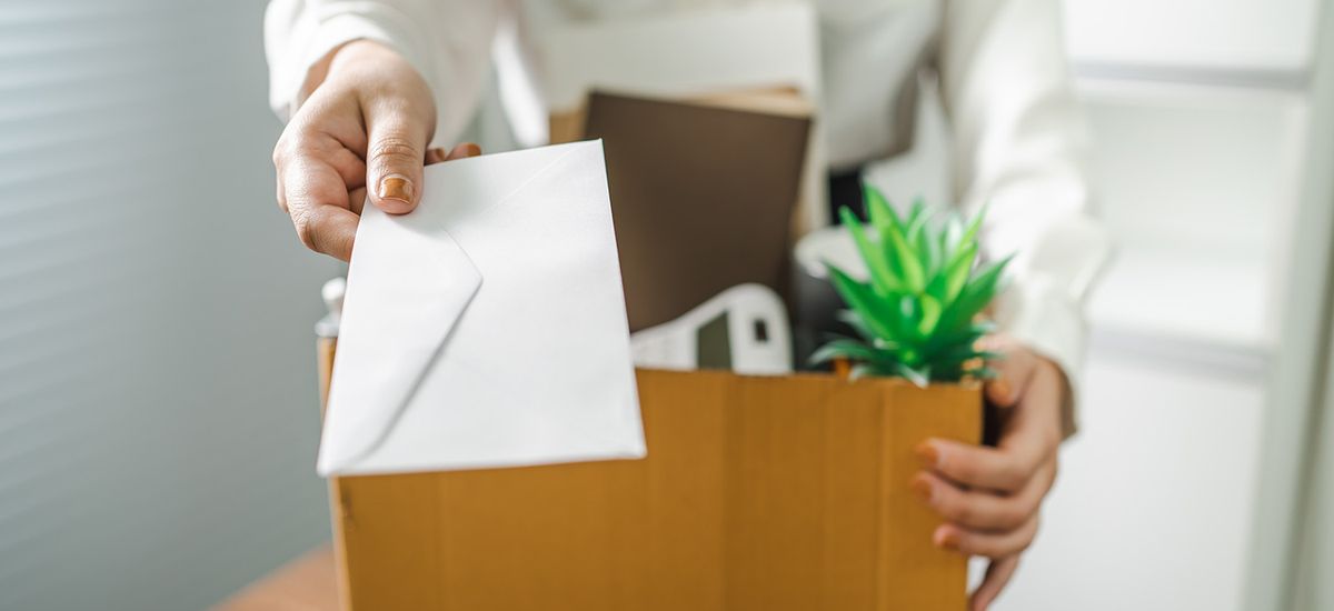 Business woman sending resignation letter and packing Stuff Resi
