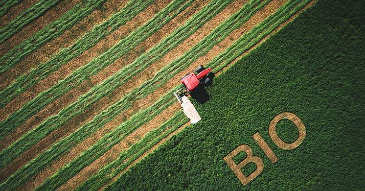 Bio concept and  tactor mowing green field