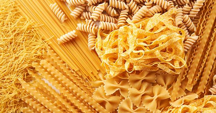 Assorted varieties of pasta background. Mix macaroni