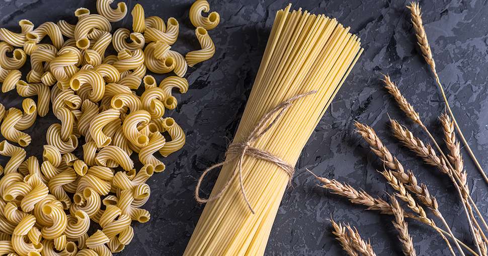 Uncooked italian pasta spaghetti and cavatappi with spikelets of