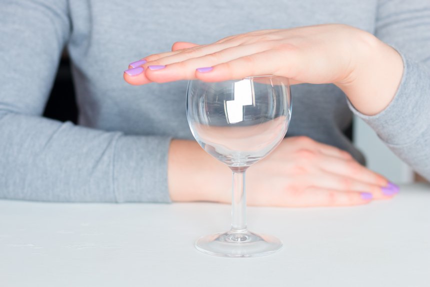 young woman and empty glass - refusal of alcohol