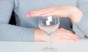 young woman and empty glass - refusal of alcohol