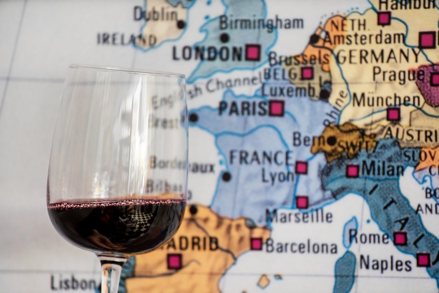 glass of wine near map