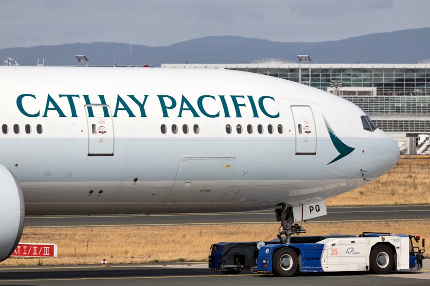 FRANKFURT AM MAIN, GERMANY - September 22, 2018: Cathay Pacific Boeing 777-300 with registration B-KPQ being towed to terminal at Frankfurt Airport.