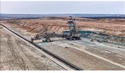 Open pit coal mine with huge backhoe digger