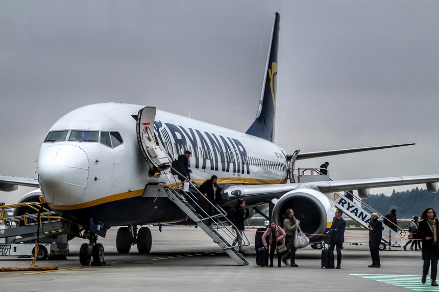 Passengers getting off the plane of Ryanair company at the Porto