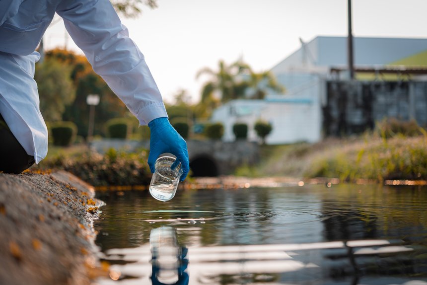 Scientists team collect water samples for analysis and research on water quality, environment with saving earth.