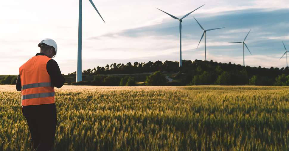 Engineer working at alternative renewable wind energy farm - Sus