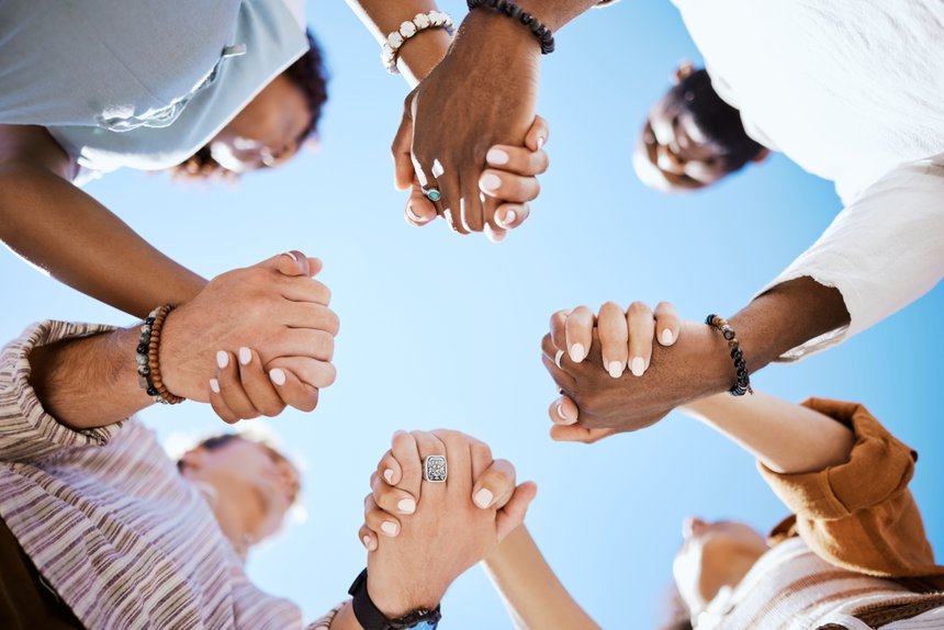 Diversity, support and people holding hands in trust and unity f