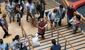 Elevated view of university students walking up and down stairs