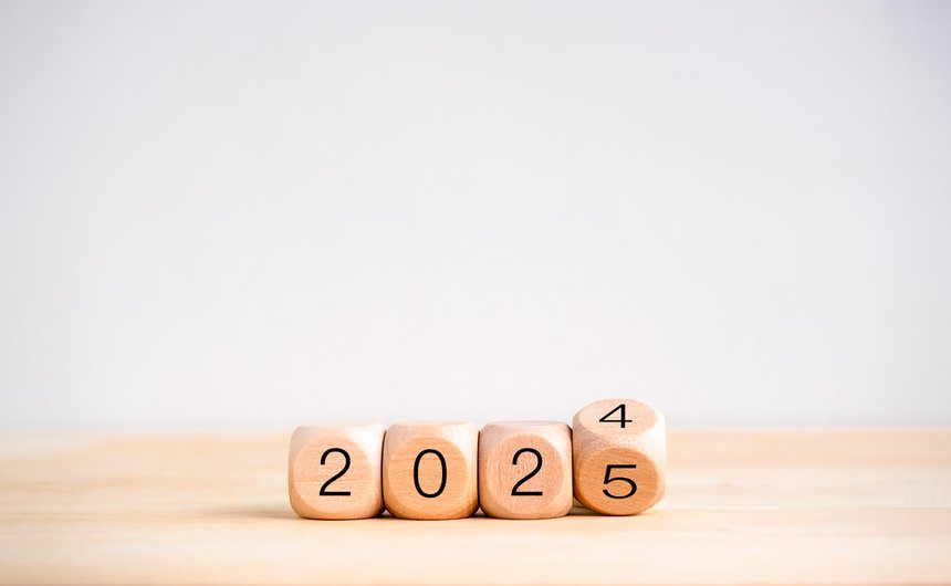 2025 happy new year with change to new era concept. Flipping the 2024 to 2025 year calendar numbers on wooden cube blocks isolated on wood table and white banner background, eco and minimal style..